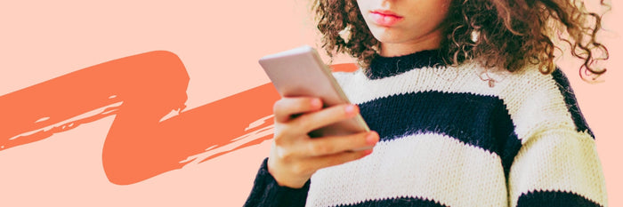 tween girl holding phone with social media